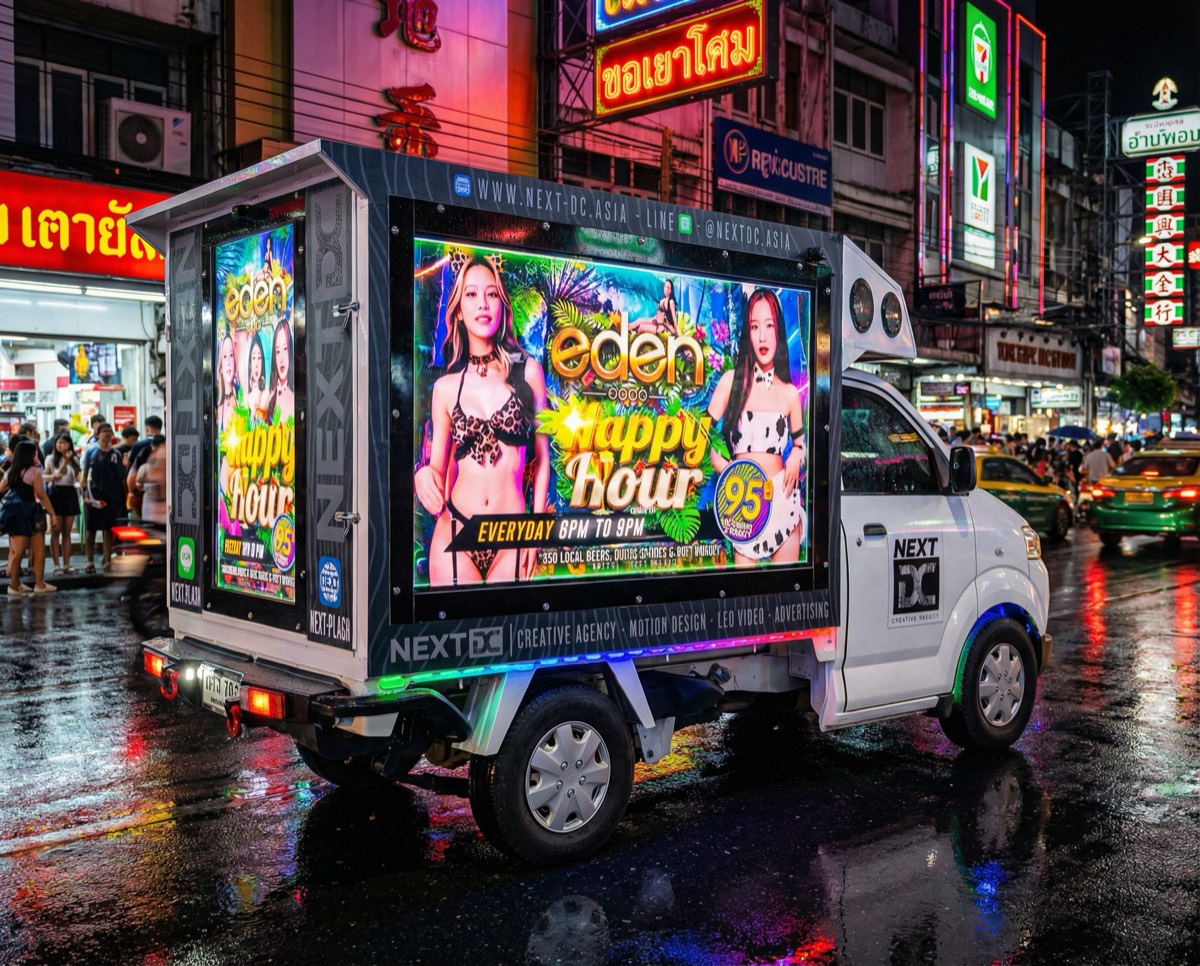 NEXT DC Video Truck showing Eden GoGo advertisement on 3 giant screens while driving through busy Pattaya night streets